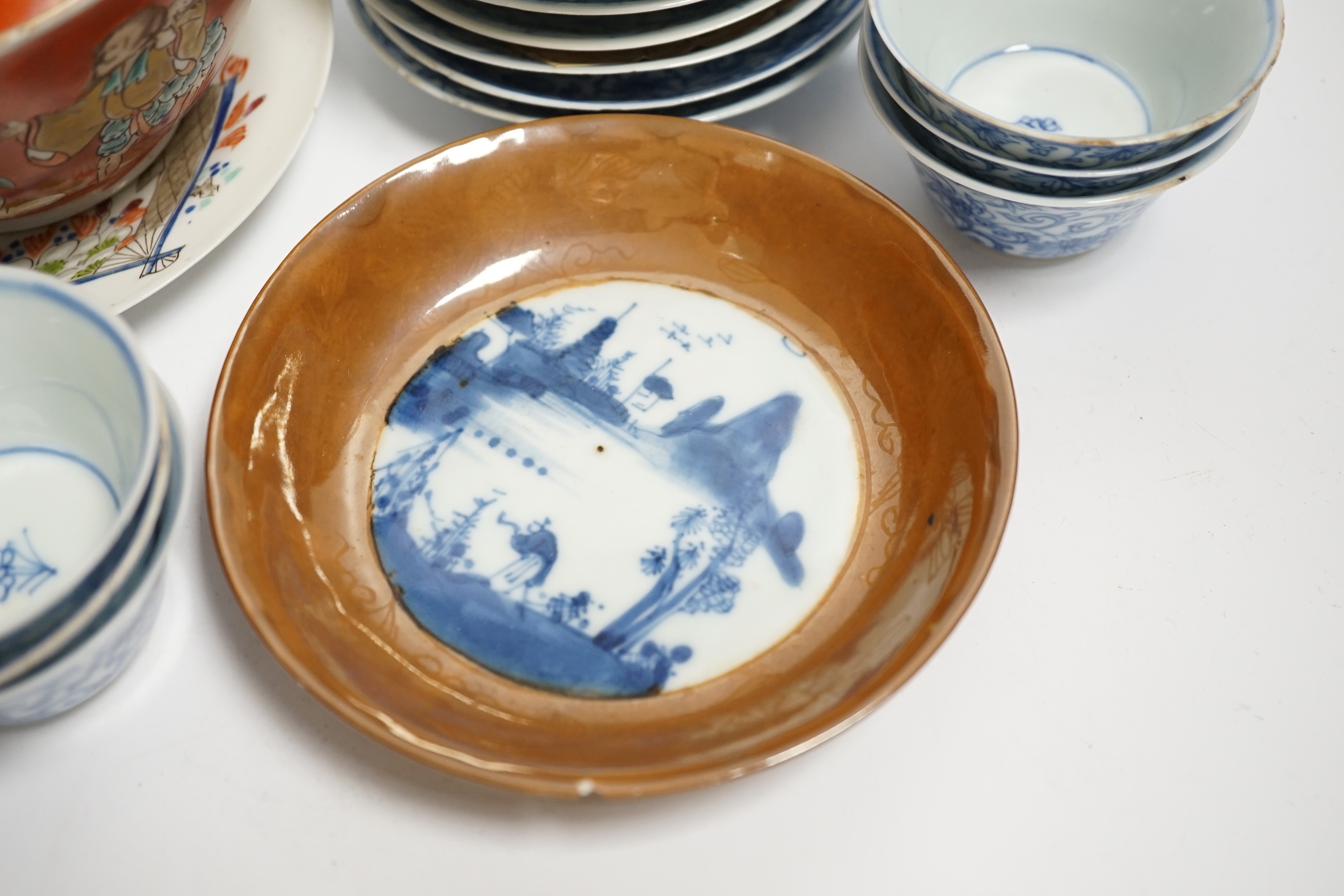 A set of six Chinese blue and white tea bowls and saucers, Kangxi period, a Chinese famille rose tea bowl and saucer, a Batavia ware saucer, both 18th century and Japanese ceramics
